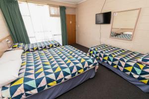 Postel nebo postele na pokoji v ubytování The Prince Mark Motel