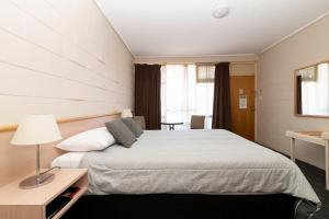 Postel nebo postele na pokoji v ubytování The Prince Mark Motel