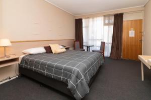 Postel nebo postele na pokoji v ubytování The Prince Mark Motel