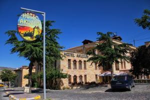 a building with a sign in front of it at Akuzun Stone Hotel in Urgup