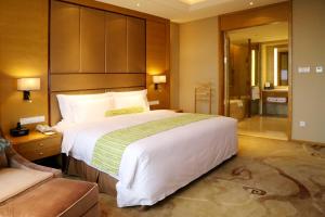 Letto o letti in una camera di Wyndham Jingzhou