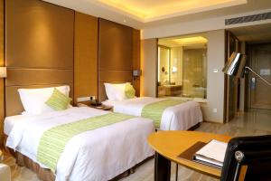 Letto o letti in una camera di Wyndham Jingzhou