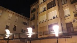 a building with lights on the side of it at Apartamento Manuela Sancho in Zaragoza