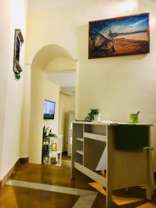 a room with a desk and a painting on the wall at Napoli Storia e Mare in Naples
