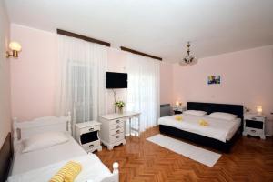 Posteľ alebo postele v izbe v ubytovaní Guesthouse Kamen Kuća