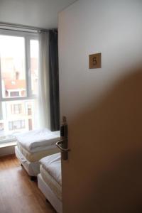 Voodi või voodid majutusasutuse Hotel Frederiksborg toas
