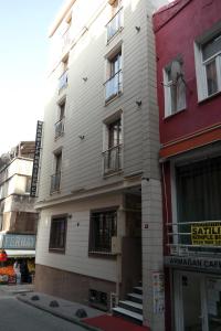 a white building on the side of a street at Sheriff Residence in Istanbul