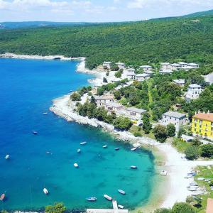 an aerial view of a beach with boats in the water at Apartment Stefania on the beach in Koromačno