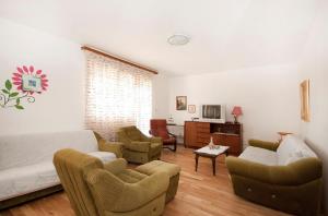 a living room with a couch and chairs at Holiday home Zlarin 1 in Zlarin