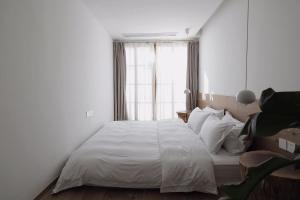 Hangzhou Moju Boutique Guesthouse at the West Lake客房内的一张或多张床位
