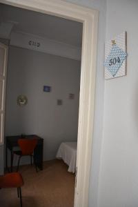 Postel nebo postele na pokoji v ubytování Pensión Moratin