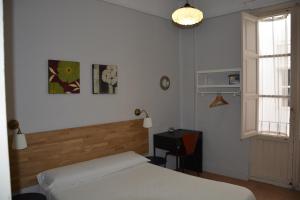 Postel nebo postele na pokoji v ubytování Pensión Moratin