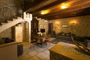 a living room with a couch and a table at Borgo degli Angeli in Balestrate