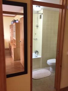 a bathroom with a toilet and a sink and a shower at Two bedroom apartment near beach and Casino in Figueira da Foz +31 photos