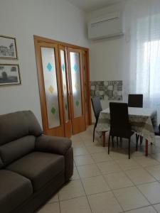 a living room with a couch and a table at Casa SereTina in Rome