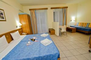 Postel nebo postele na pokoji v ubytování Stella Hotel