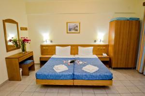 Postel nebo postele na pokoji v ubytování Stella Hotel