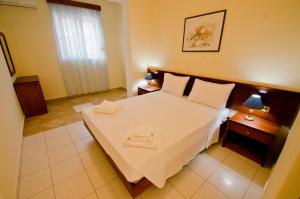 Postel nebo postele na pokoji v ubytování Stella Hotel