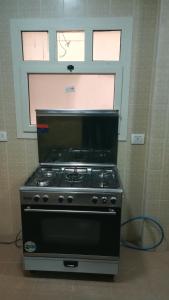 Η κουζίνα ή μικρή κουζίνα στο Gazzar inn Madinaty15 +9 φωτογραφίες