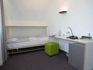 Postel nebo postele na pokoji v ubytování Comfor Hotel Ulm City