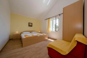 a bedroom with two beds and a window at VILLA LIDIA in Mundanije +42 photos