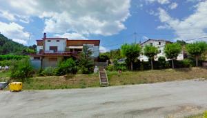 a house sitting on the side of a road at Hostal El Violí in Cardona