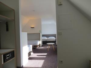 Postel nebo postele na pokoji v ubytování Comfor Hotel Ulm City