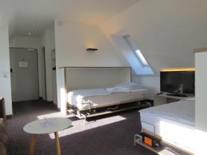 Postel nebo postele na pokoji v ubytování Comfor Hotel Ulm City