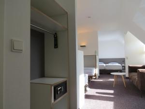 Postel nebo postele na pokoji v ubytování Comfor Hotel Ulm City