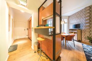 Televízia a/alebo spoločenská miestnosť v ubytovaní Design Apartments - "Im Holländerhaus"