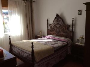A bed or beds in a room at Vivenda Atlantico