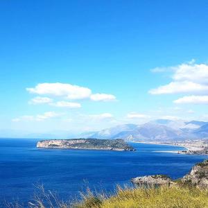 an island in the middle of a large body of water at Hotel Villa Principe in San Nicola Arcella