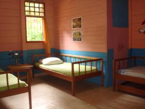 Giường trong phòng chung tại Se'pon Homestay