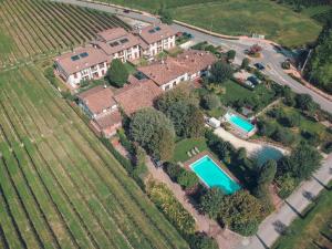 an aerial view of a house with a swimming pool at La Favola Sirmione in Sirmione