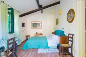 Säng eller sängar i ett rum på Agriturismo La Montagnola