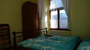 Postel nebo postele na pokoji v ubytování Penzion SKLAŘSKÁ HOSPODA
