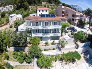 an aerial view of a large white house at Apartments Tina in Brela