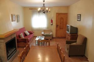 a living room with a couch and a table at Casa Mercedes in Molinicos