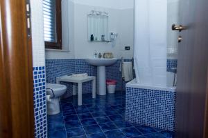 a bathroom with a sink and a toilet and a tub at Gli Ulivi Dell'Etna in Linera +158 photos