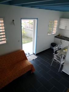 a room with a bed and a table and a window at Beau duplex in Trois-Rivières