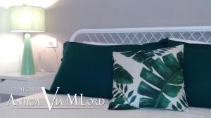 A bed or beds in a room at Dimora Antica Via MiLord