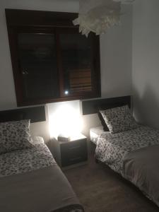 A bed or beds in a room at Oriuelha Costa Terrazas de Campoamor Még 15 kép