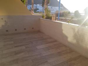 a room with a wooden floor and a window at Apartamento SOLYMAR 3 in San José +30 photos