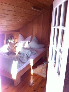 Postel nebo postele na pokoji v ubytování Schatzl Hütte