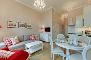 a living room with a couch and a table at BE IN GDANSK Apartments - IN THE HEART OF THE OLD TOWN - Ogarna 10 in Gdańsk