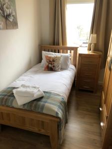 Säng eller sängar i ett rum på 12 Lochiel Road