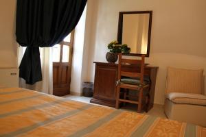 A bed or beds in a room at Hotel I Platani