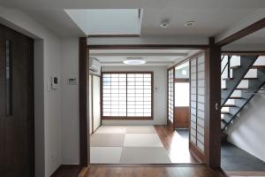 a hallway with a staircase in a house at 京都 六花庵 Kyoto Rokkaan in Kyoto