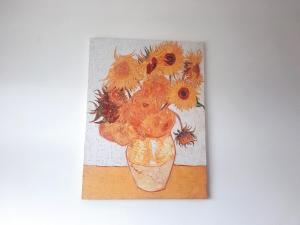 a painting of a vase filled with sunflowers at Taining Happy Stone Duplex Apartment in Taining