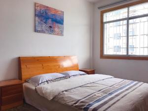 Łóżko lub łóżka w pokoju w obiekcie Taining Happy Stone Duplex Apartment